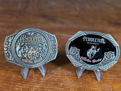 MONTANA SILVERSMITHS, PENDLETON WHISKY BELT BUCKLES. This lot features a pair of limited edition 