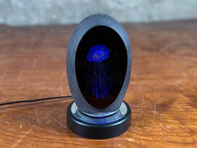 GLASS "JELLYFISH" ART. This lot features a glass paperweight "jellyfish" sculpture with a 