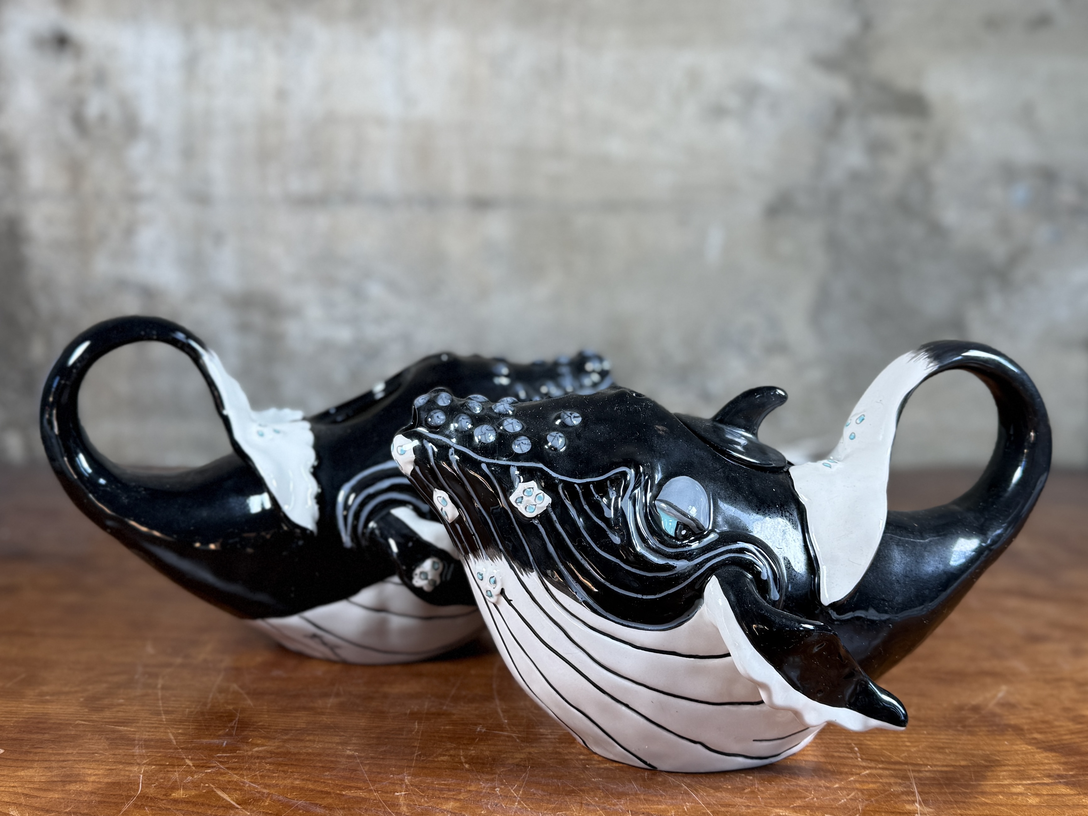 BLUE SKY CLAYWORKS, PAIR OF WHALE TEAPOTS