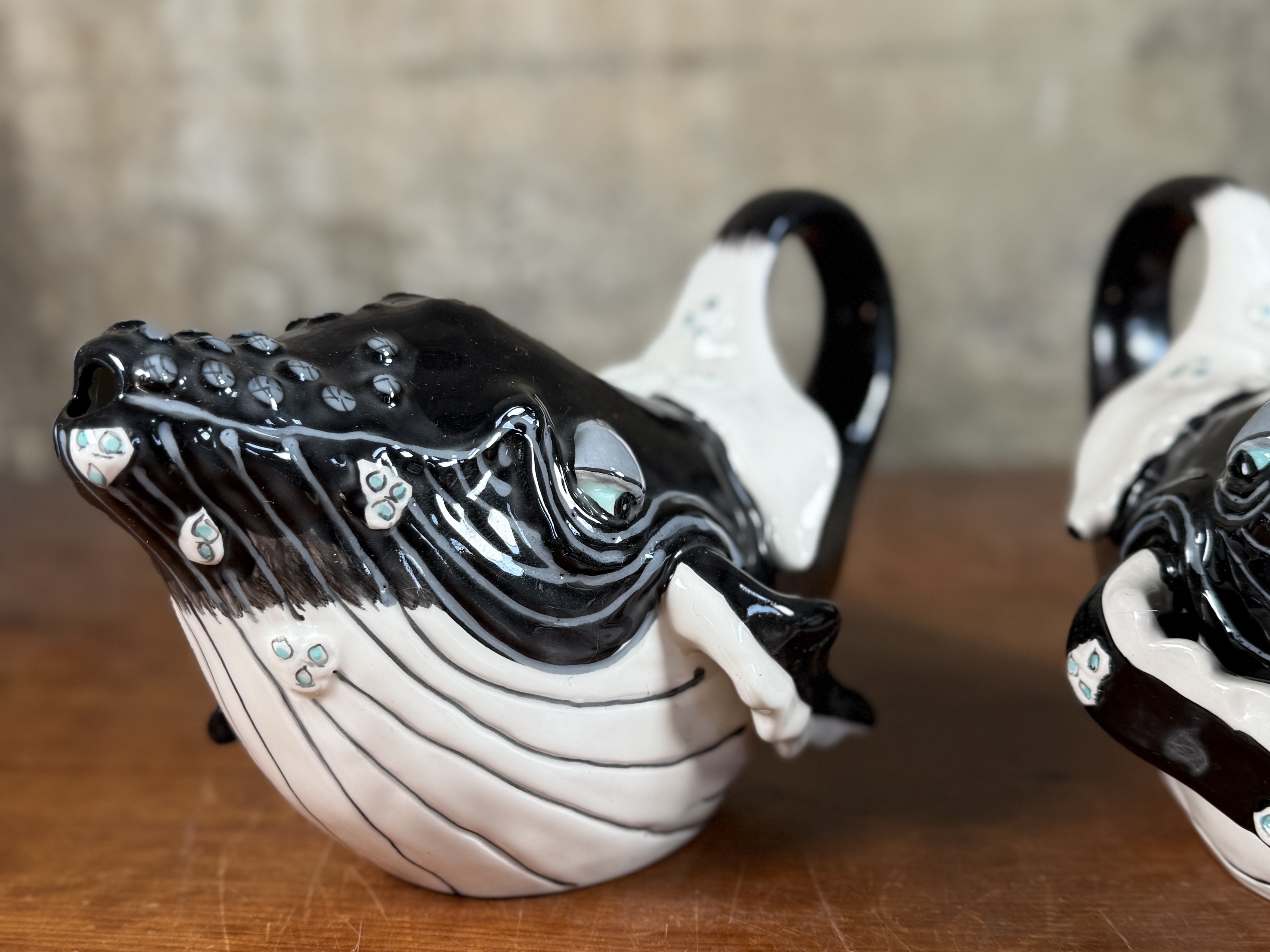BLUE SKY CLAYWORKS, PAIR OF WHALE TEAPOTS