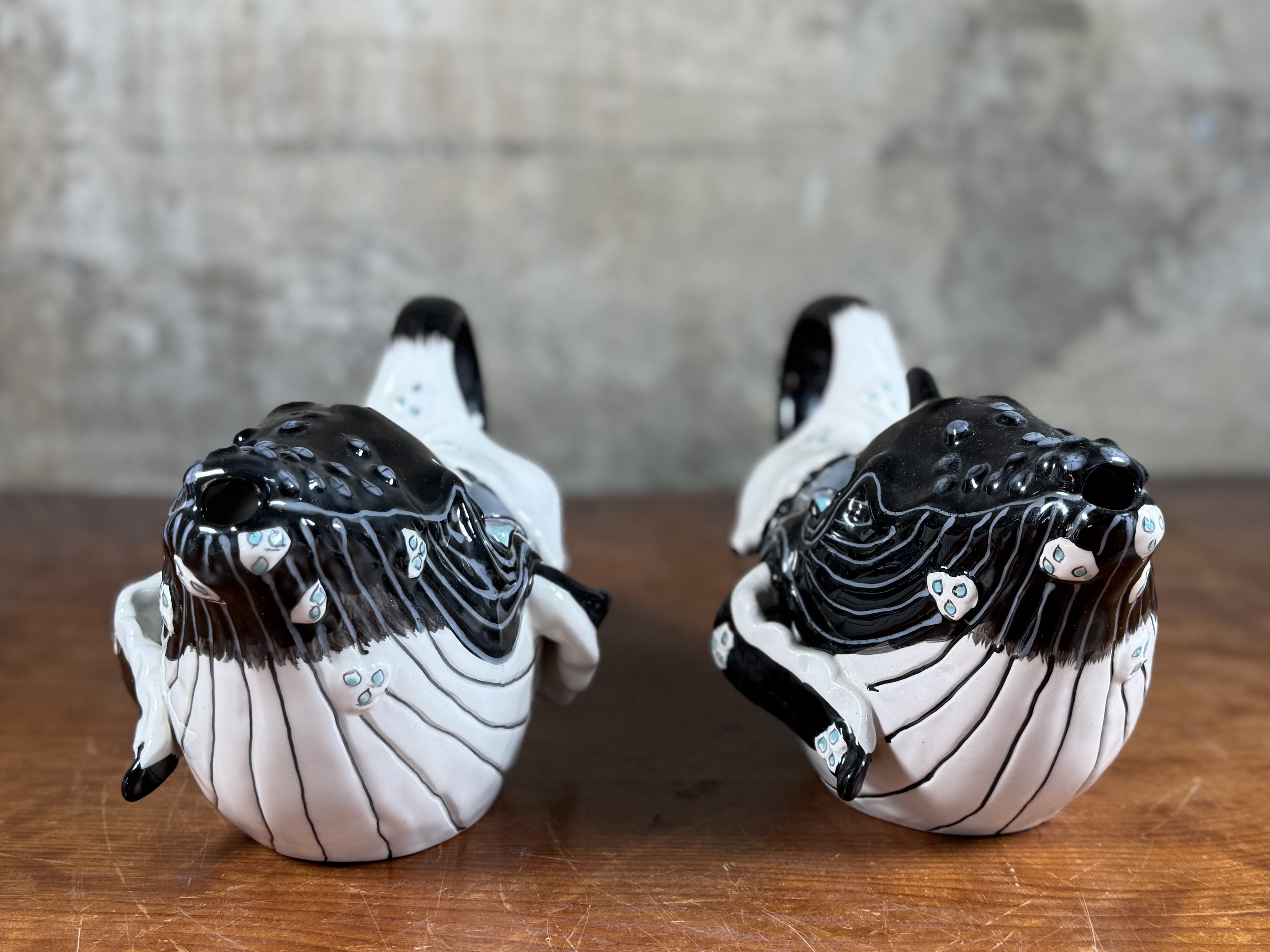 BLUE SKY CLAYWORKS, PAIR OF WHALE TEAPOTS