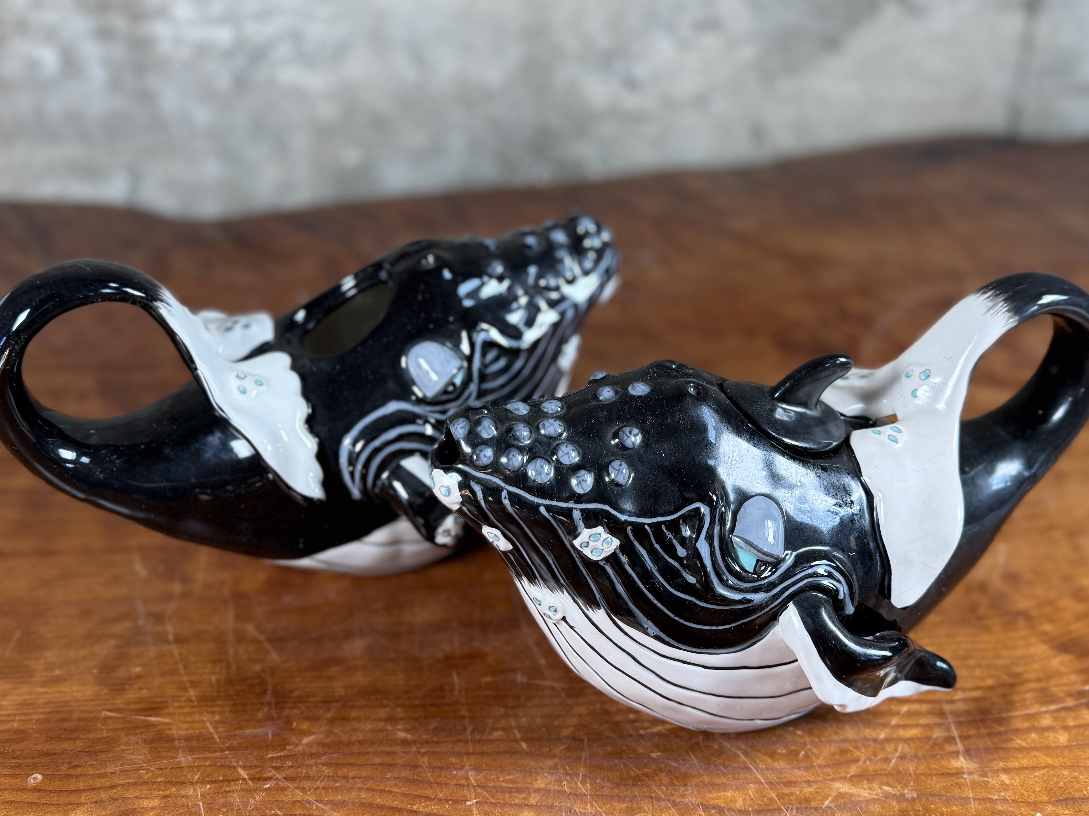 BLUE SKY CLAYWORKS, PAIR OF WHALE TEAPOTS