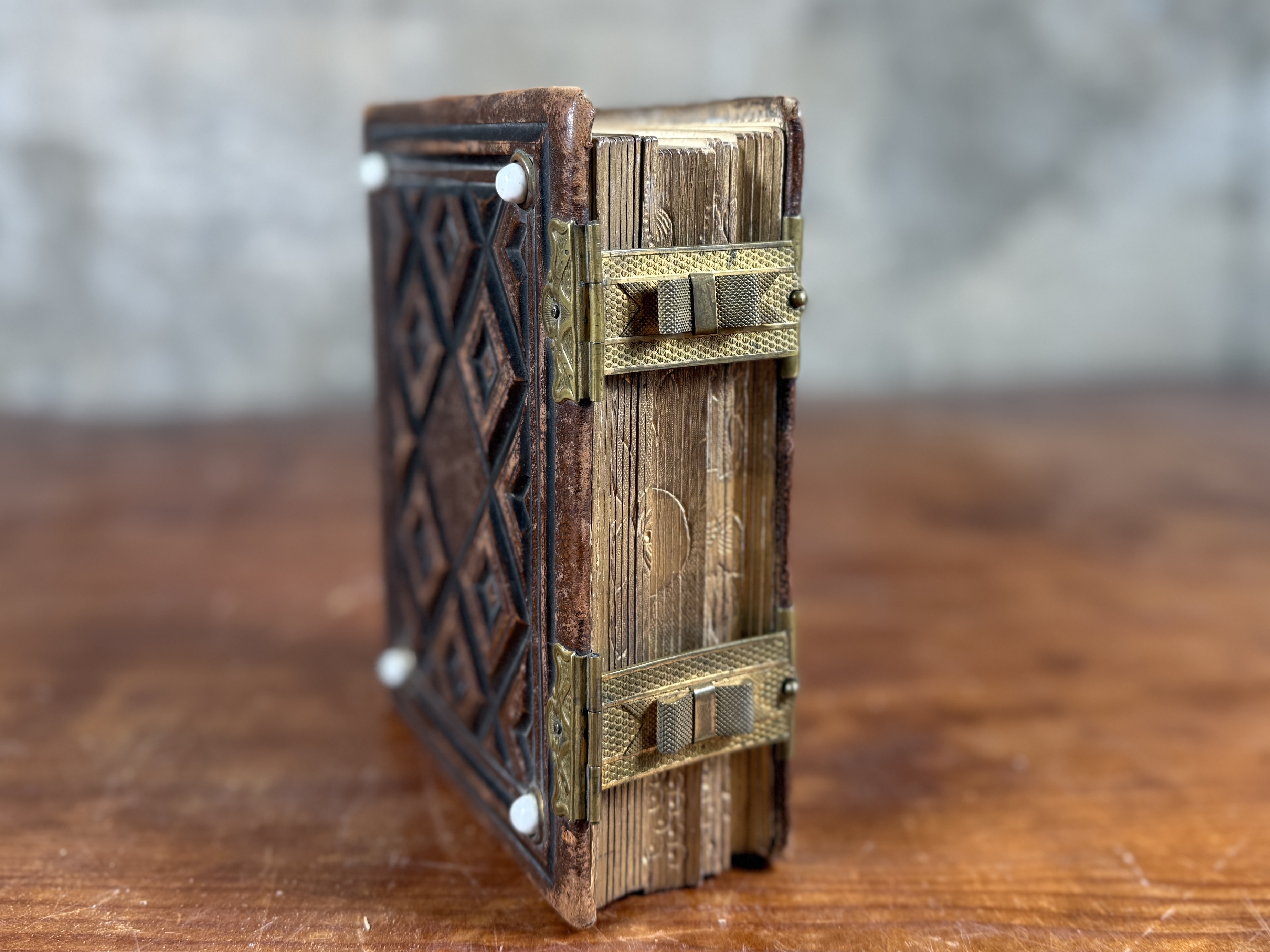 19TH CENTURY EMBOSSED LEATHER PHOTO ALBUM