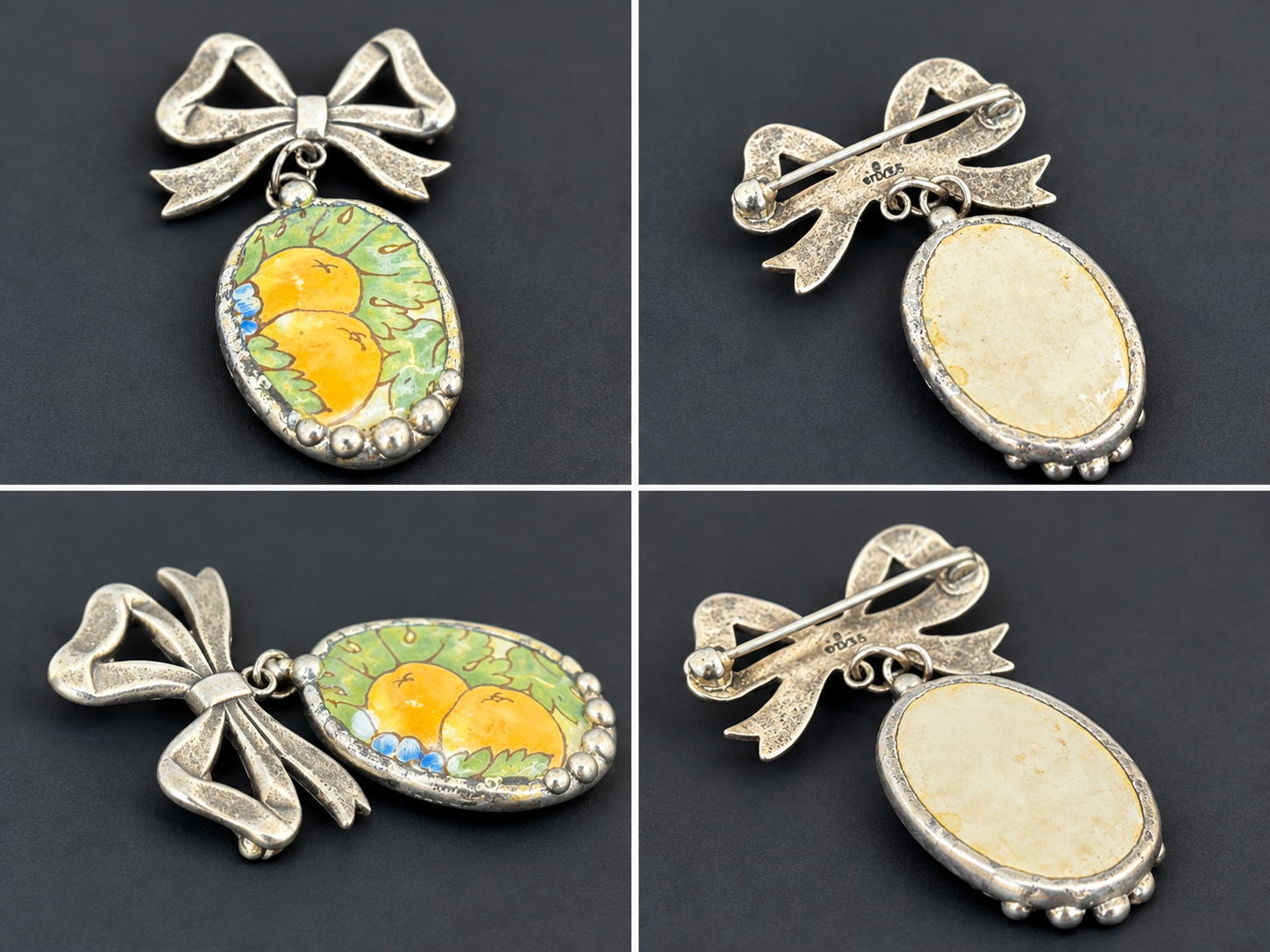 STERLING BOW BROOCH WITH PAINTED CERAMIC DESIGN