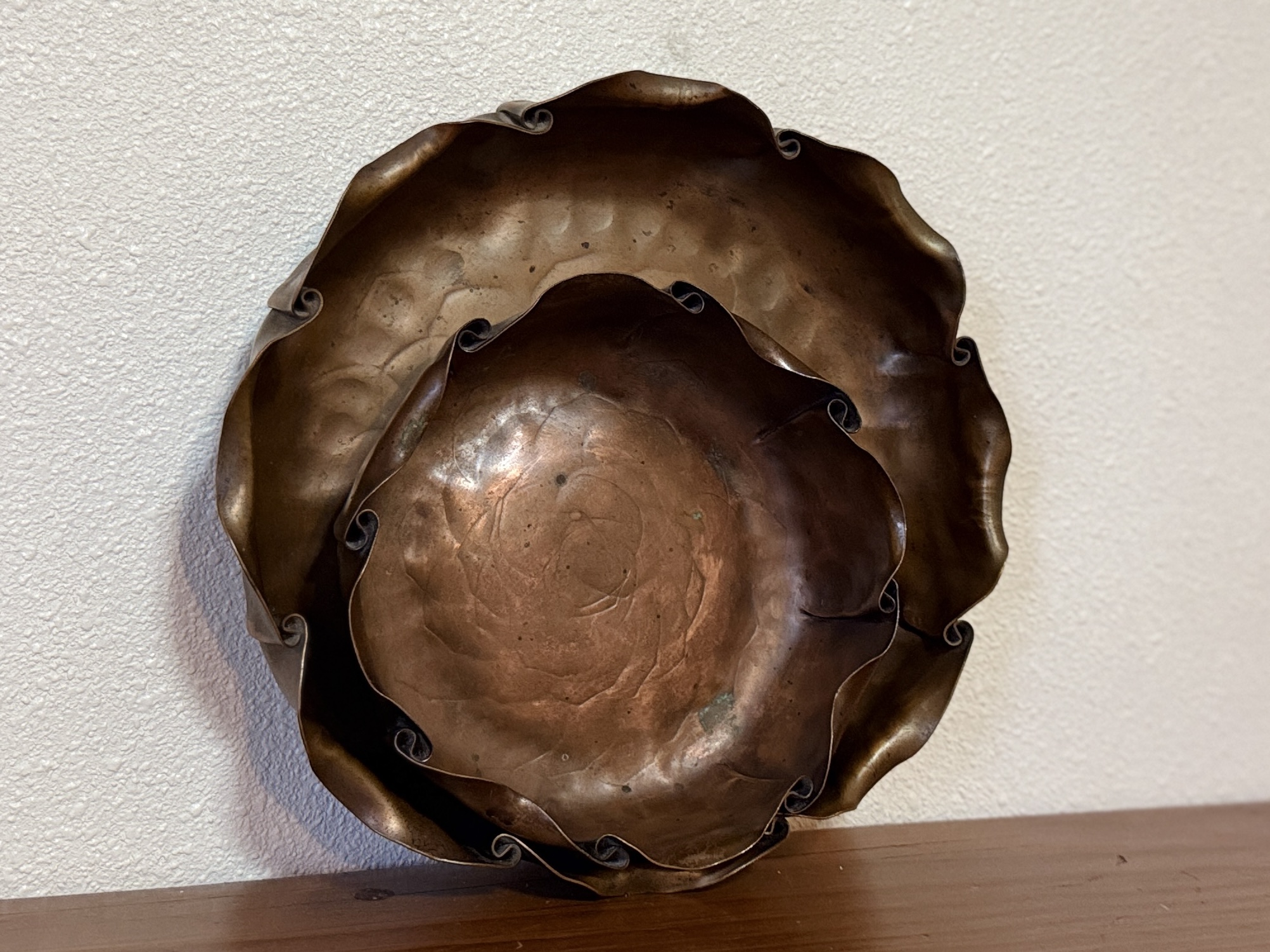 PAIR OF COPPER BOWLS WITH CURLING EDGES