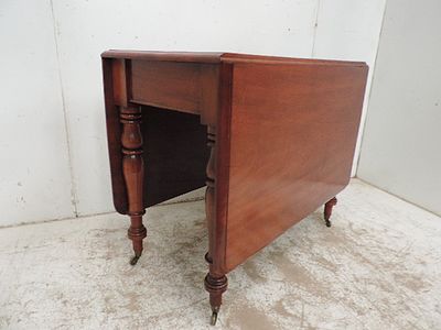Victorian Solid Polished Mahogany Drop Leaf Table on Turned Legs with Casters