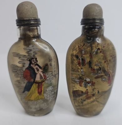 Chinese Reverse Painted Snuff Bottles Pair of bottles with images depicting Feudal Lord and 