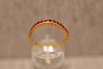 Ruby ring. Half-eternity ring with rubies, 18K yellow gold; 2.5g; triangular design, ring size 58