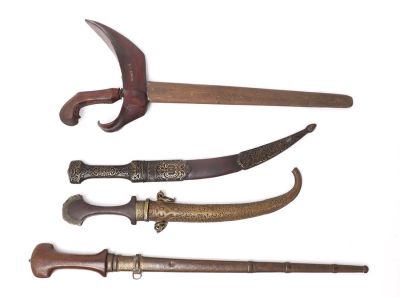 Assorted lot of Daggers. Fine assorted lot of daggers including an all wood kris and matching 