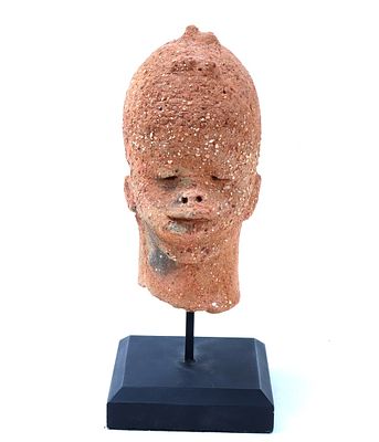 Nok Terracotta Baby Head, 500 BCE - 200 CE. A finely crafted Nok terracotta head, originating 