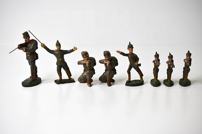 8 WWI Prussian Composition Soldiers. No markings. Largest standing is 4 inches tall. They have 