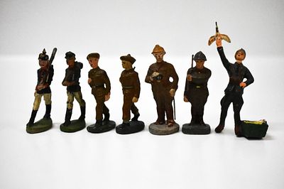 7 Composition Soldiers. No markings on them. The pigeon keeper is a interesting pose. He is 