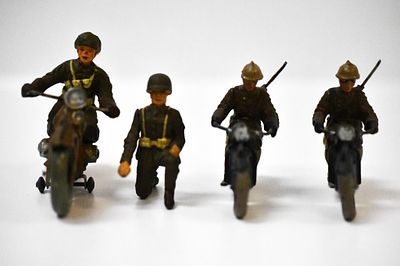Composition Military Motorcycles. Larger 1 with the tin wheels i believe is a durso. Riders head 
