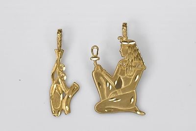 14K Gold Charms 7.59g. Includes 2 charms including a an Egyptian goddess. Both pieces measure 