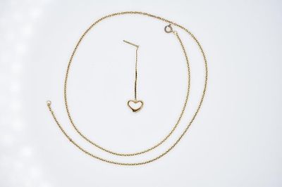 14K Gold Necklace and More 3g. Includes 14K gold necklace (approximately 17" long) and 1 odd 