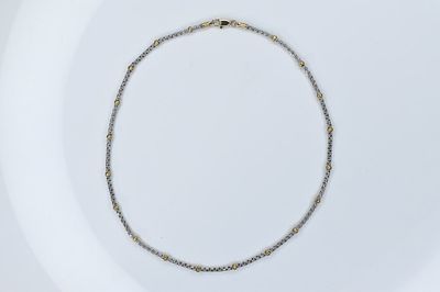 14K Gold Necklace 8.08g. White gold necklace with yellow gold stations measuring approximately 16"l.