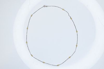 18K Gold Necklace 3.93g. White and yellow with stations needs repair. The overall length 