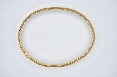 14K Gold Bangle 8.56g. Engraved yellow gold bangle measuring 2.5" wide when closed and 3? open.