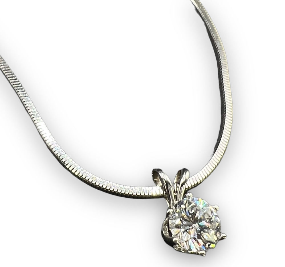 1 Carat Diamond Pendant W/ 14K Necklace 18". Per the appraisal: 
One 14kt white gold and diamond 