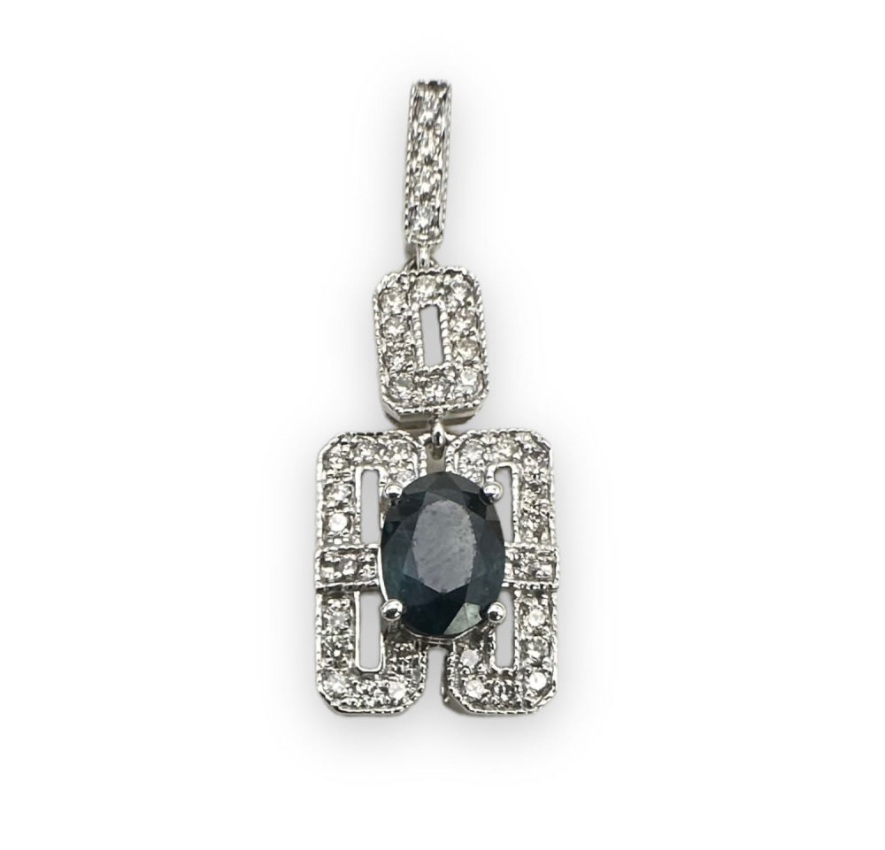 14K White Gold, Sapphire, & Diamond Pendant. Per the appraisal: 
One 14kt white gold, sapphire 