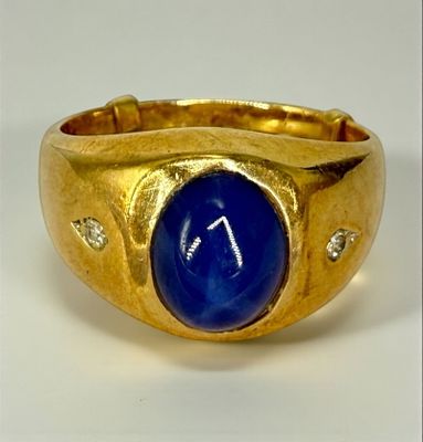 10K Yellow Gold Star Sapphire and Diamond Men’s Ring. 10mm x 8mm star sapphire accented by two 