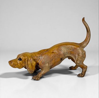 Charles Virion Dachshund/Basset Hound Stone Figure. Flamed Covered Sandstone sculpture with 