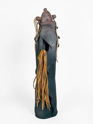 Elizabeth Abeyta Rohrscheib "Mudhead" Figure. Signed on the back. 
Dimensions: 17" Tall 