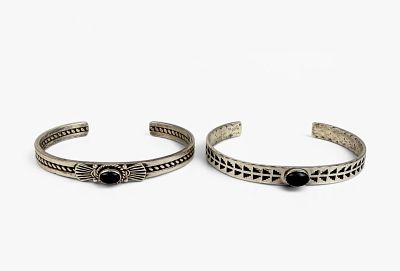 (2) Navajo Sterling Silver & Onyx Cuffs. Cuffs are marked by different artists. 
Size: Both 2 