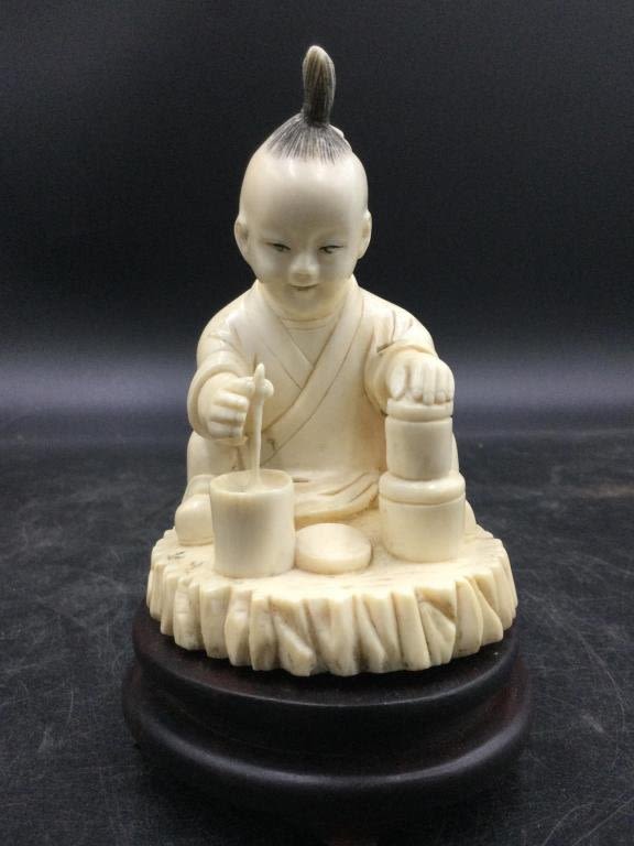 Lot 128: Carved Child