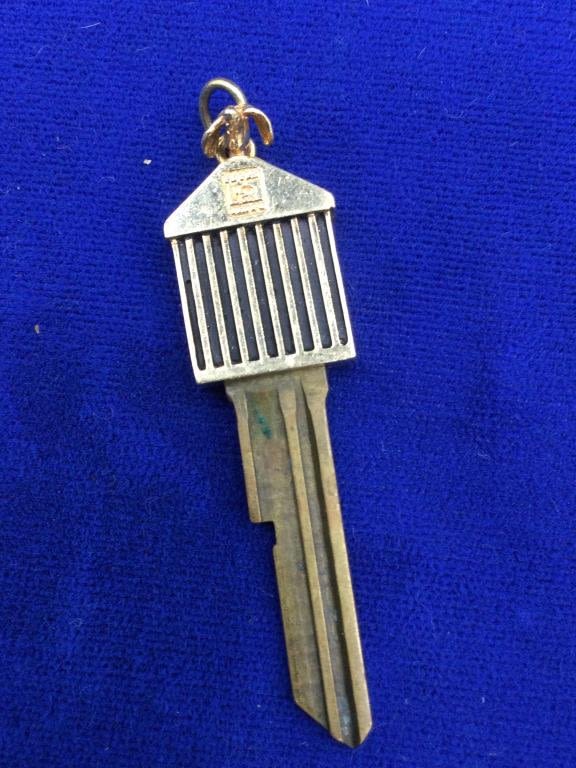 Lot 214: 14kt gold top Rolls Royce Key