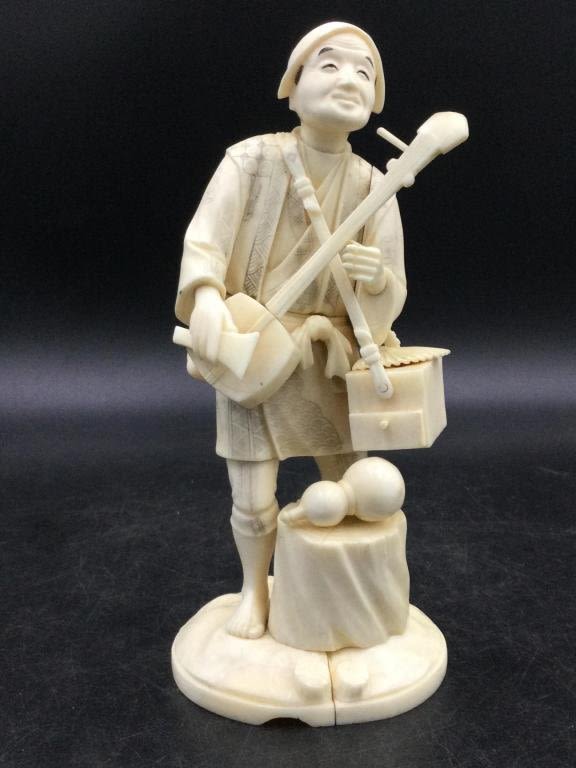 Lot 250: Carved Musician