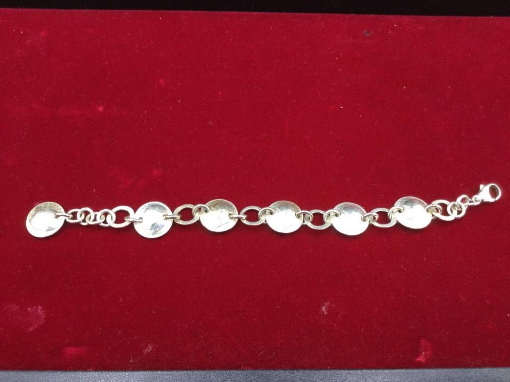 Lot 52: Sterling Coin Bracelet