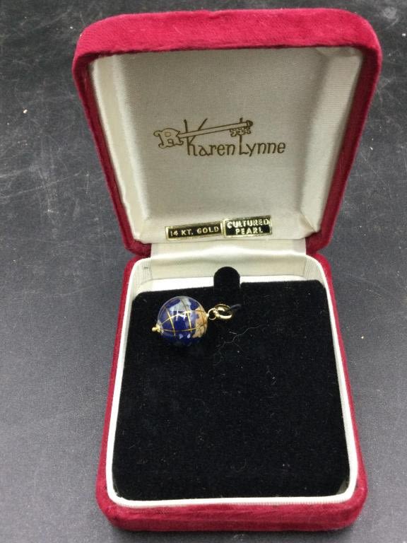 Lot 118: 14kt Gold & Enamel Globe Pendant