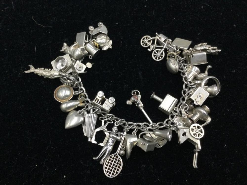 Lot 182: Sterling Charm Bracelet