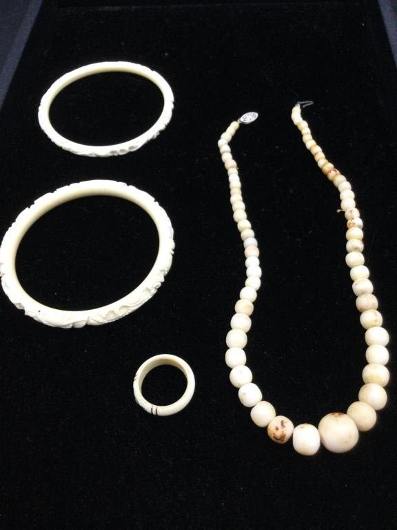 Lot 114: Carved Jewelry