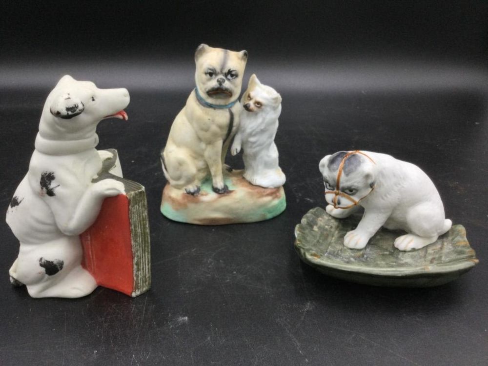 Lot 264: Antique Porcelain Dog Statues