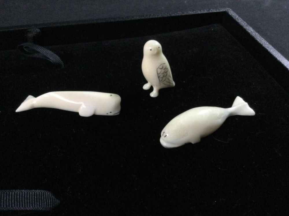 Lot 140: Carved Alaskan Inuits
