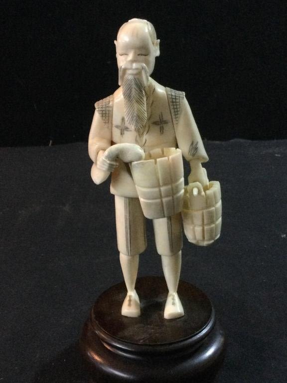 Lot 271: Carved Village Man