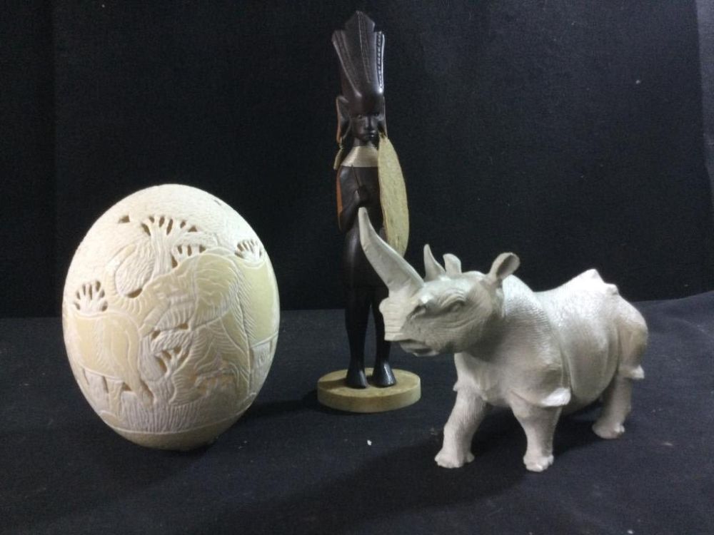 Lot 149: Carved Rhino, Ostrich Egg & Statues
