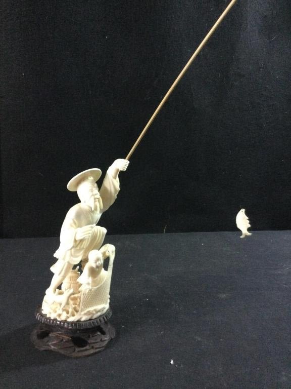 Lot 191: Carved  Fisherman