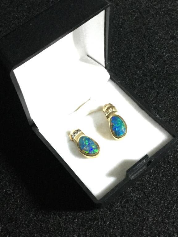 Lot 103: Opal Gold Earrings