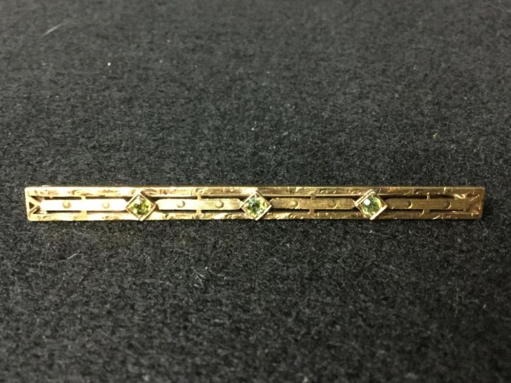 Lot 135: Gold Bar Pin with Peridot