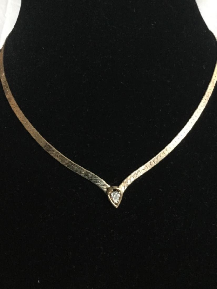 Lot 34: 14kt Necklace with Diamond
