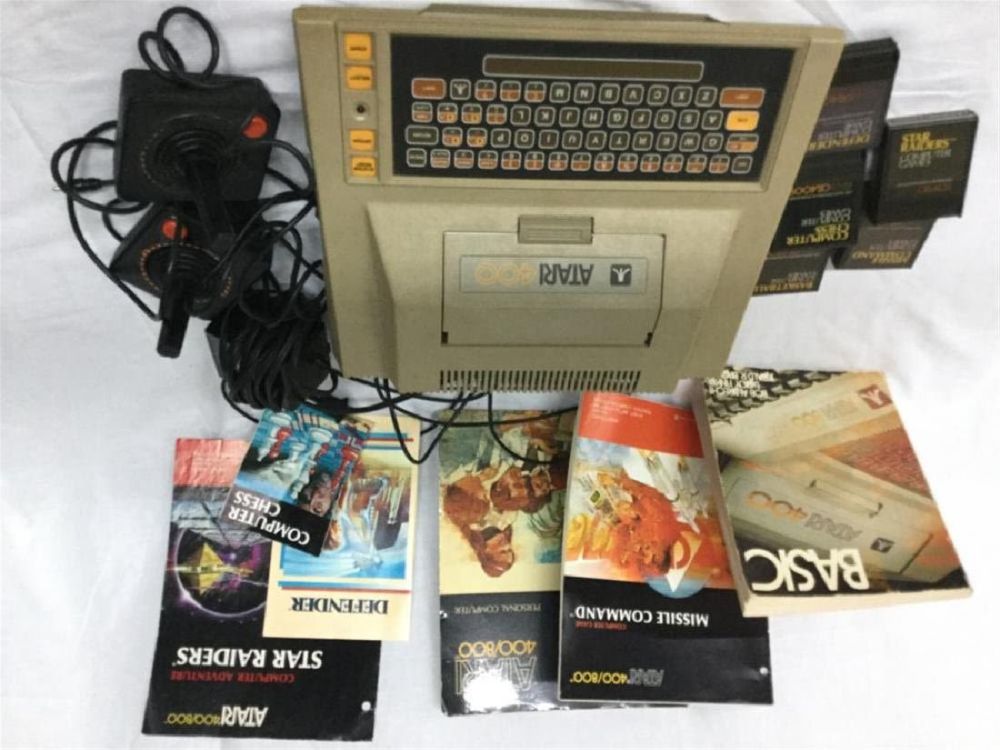 Lot 166: Vintage Atari with games