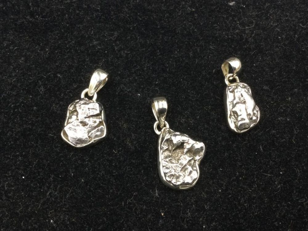 Lot 191: Meteorite Sterling Charms