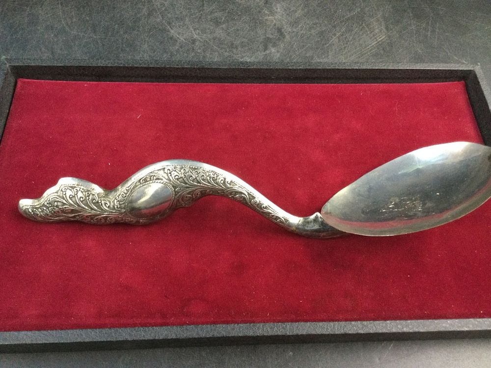 Lot 180: Sterling Repousse Serving Spoons