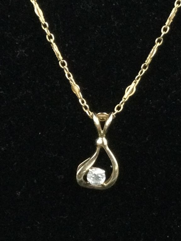 Lot 202: 14kt Gold with Diamond
