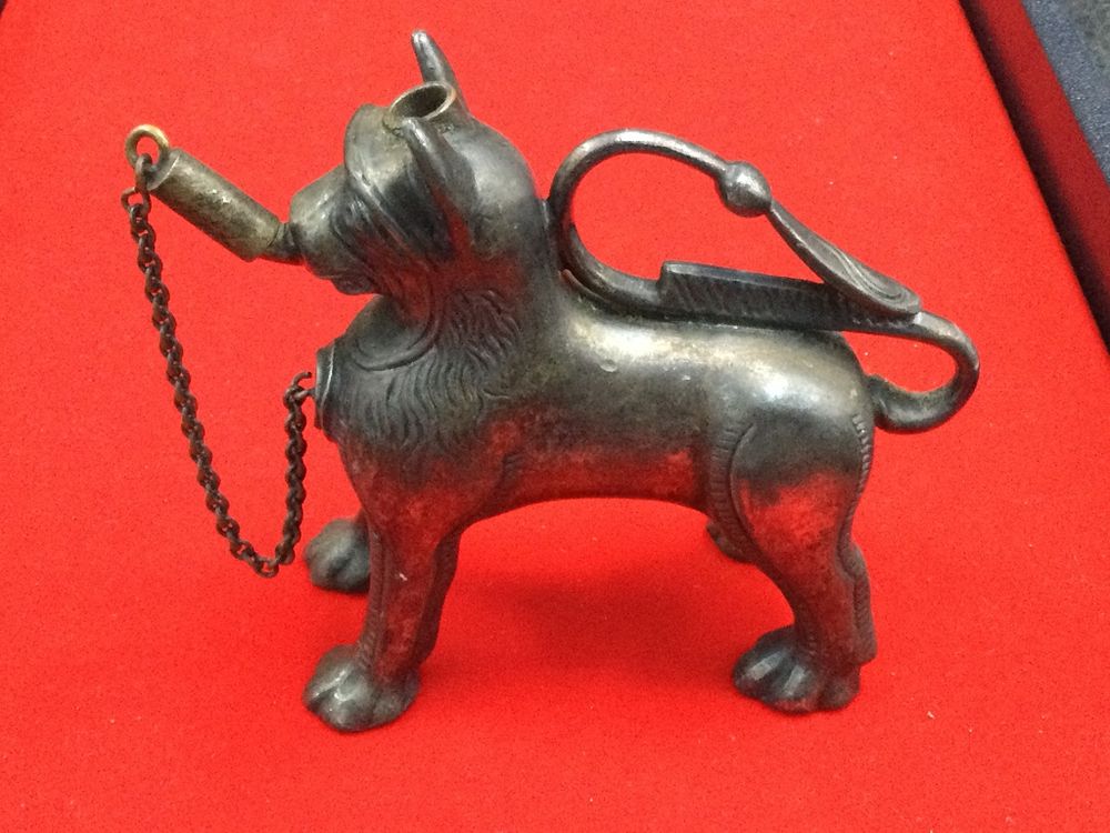 Lot 173: Aquamarine Lion Oil Lamp German