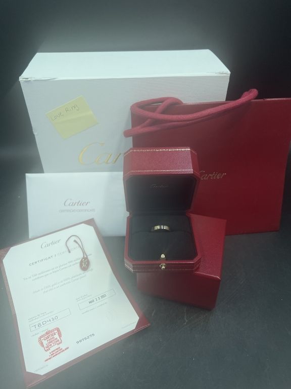 Lot 194: Cartier Love Ring with Box and Papers