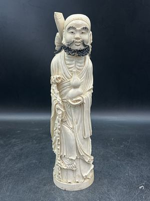Vintage Hand Carved Ivory Scholar. Measures 12 1/4"h and solid piece. Piece is signed on the